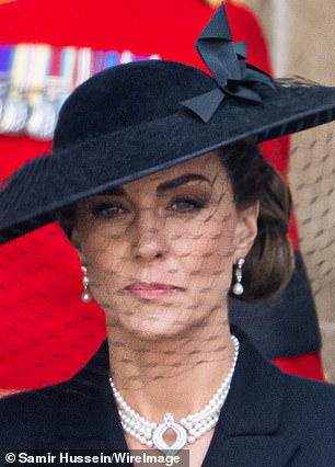 Kate accessorised with the Japanese pearl choker and Bahrain pearl drop earrings, which were created from pearls gifted to Elizabeth on her wedding day in 1947