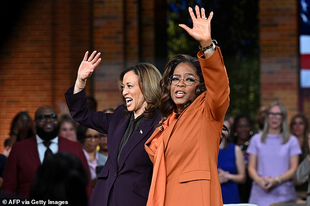 Harris and Winfrey wave to the crowds during a 'Unite for America' live streaming rally in Farmington Hills, Michigan