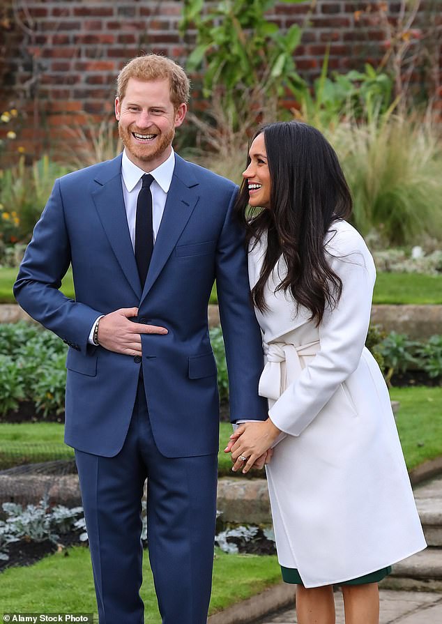 Meghan holds her fiancé's hand during their engagement announcement at Je in 2017