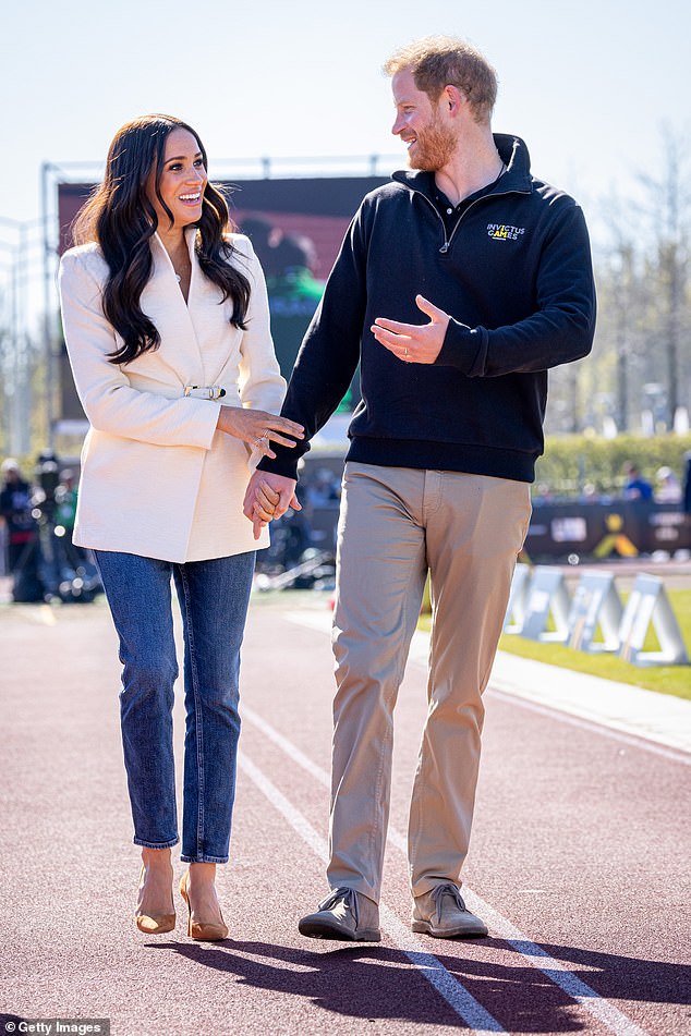 The couple holding hands at an Invictus Games event in Hague, 2022