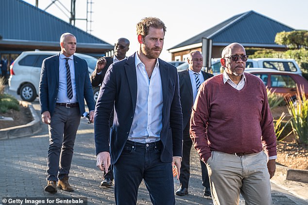 Prince Harry walks next to Prince Seeiso of Lesotho for the welcome event