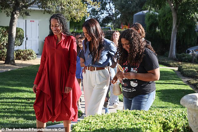 ) Dr. Stephanie J. Hull and Meghan Markle, The Duchess of Sussex seen smiling at Girls Inc