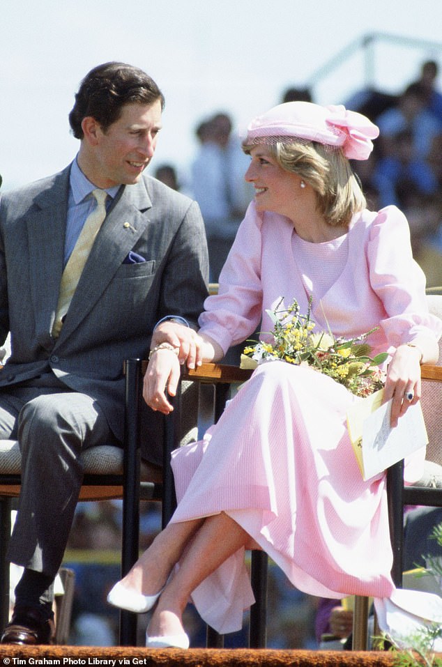 The Prince of Wales puts an affectionate hand on Diana during their first tour together, to Australia