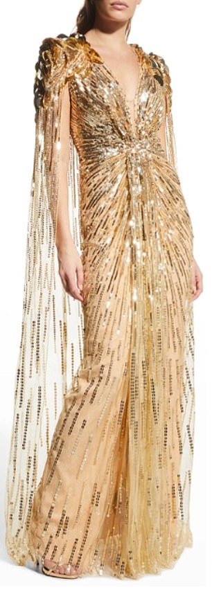 Adorned with gold sequins, the glamorous dress showcased structured shoulders