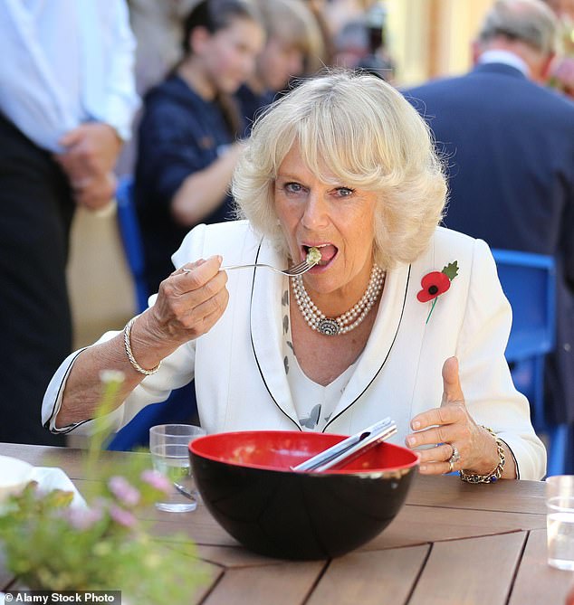 Queen Camilla enjoys lunch during the same visit to the Kilkenny Primary School in Adelaide, Australia in 2012