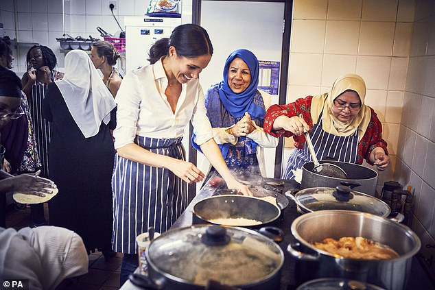 Meghan cooking with women in the Hubb Community Kitchen in London in 2018