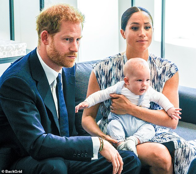 The couple pictured with Archie, their first born son