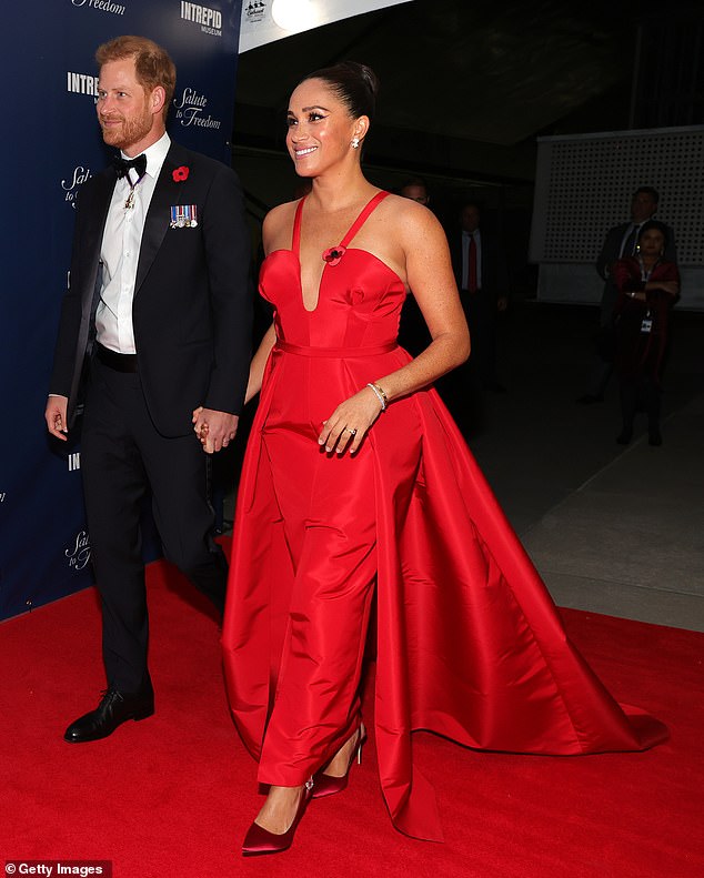 Prince Harry and Meghan Markle are pictured at the Salute To Freedom Gala in New York in 2021, wearing the same dress