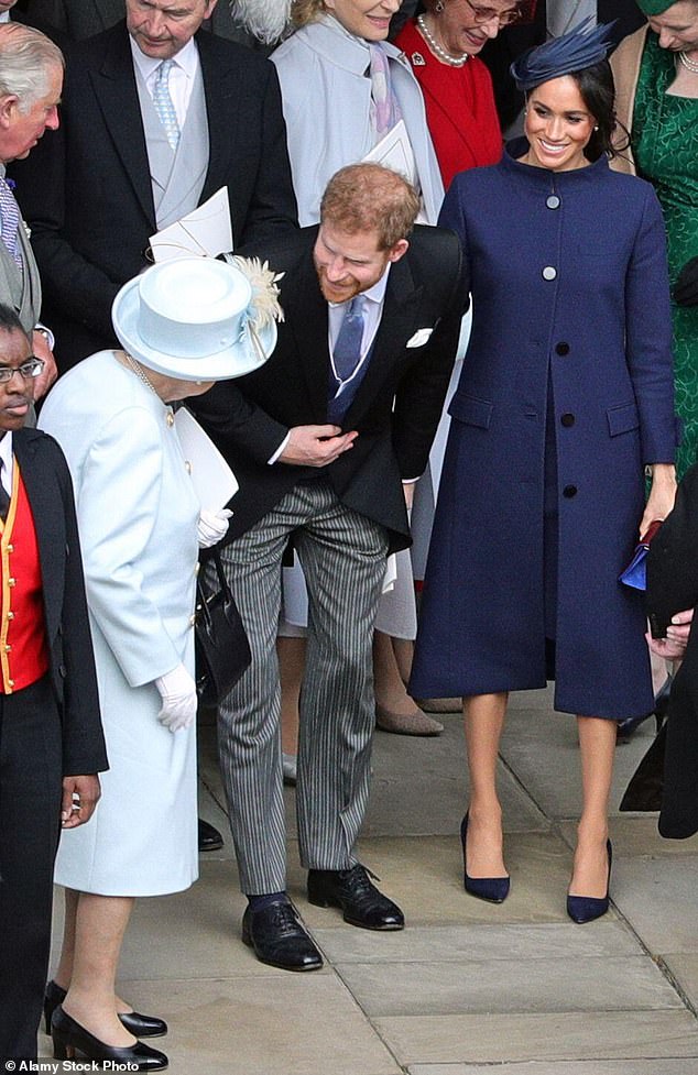 Prince Harry, with his wife Meghan, talking to the late Queen Elizabeth outside St George's Chapel after Princess Eugenie and Jack Brooksbank's wedding in 2018