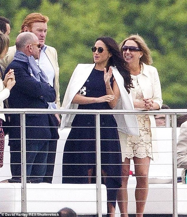 Meghan watches Harry take part in a polo game at Coworth Park in Berkshire in 2017