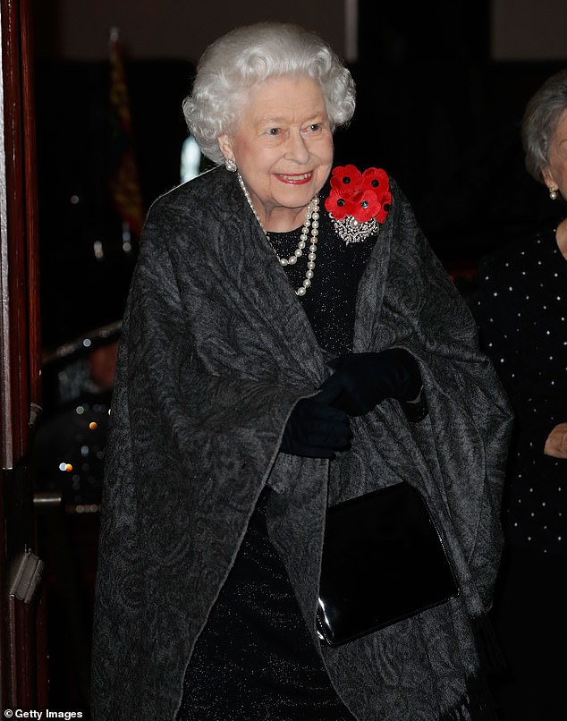 2018: Queen Elizabeth II attends the Royal British Legion Festival of Remembrance at the Royal Albert Hall last night, complete with a cluster of five poppies