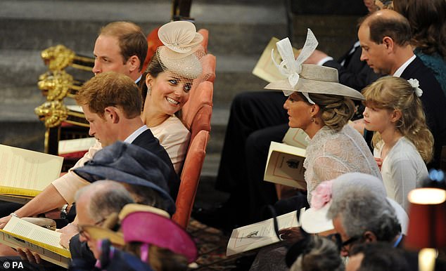 The Duchess of Cambridge speaks to the Countess of Wessex during the service to celebrate the 60th anniversary of the Coronation of Queen Elizabeth II at Westminster Abbey