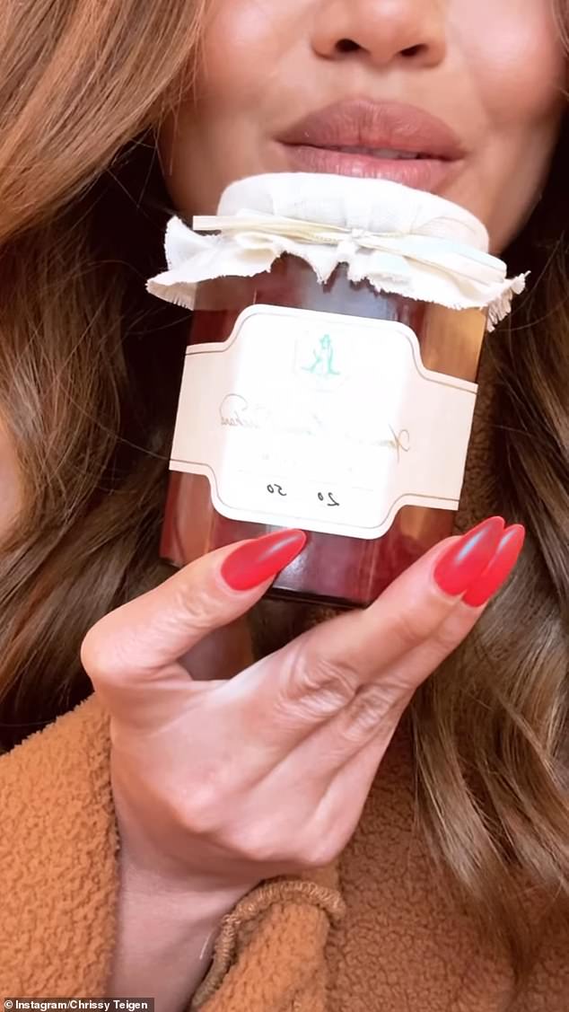 Chrissy Teigen showing off her jam from Meghan's American Riviera Orchard