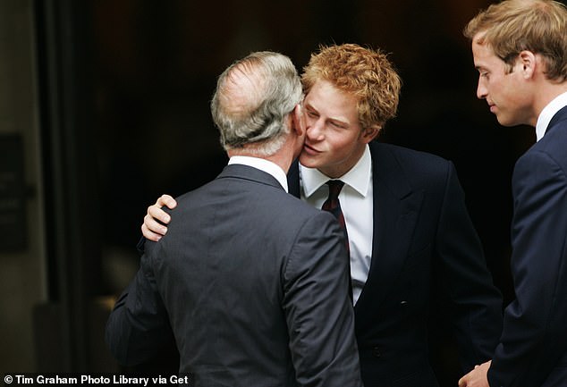 Prince Harry is pictured greeting his father during the 10th Anniversary Memorial Service For Diana, Princess of Wales in 2007