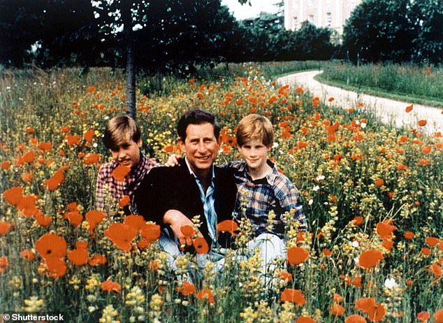 Prince Harry with his arm around his father, Prince Charles, on a Christmas card in 1994