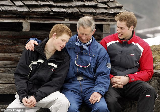 Prince Charles puts his arm around his son Harry, with William watching on, at Klosters in 2005