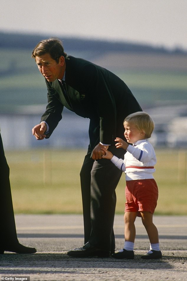 Prince Charles and Prince William board the Queen's Flight plane at Aberdeen Airport in Scotland on September 7, 1984 after a holiday in Balmoral