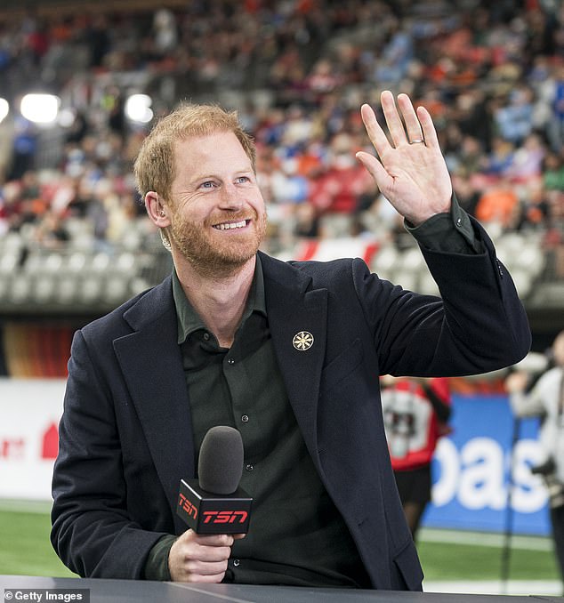 Prince Harry waves to fans prior to the start of a TV interview before the start of the 2024 Grey Cup at BC Place