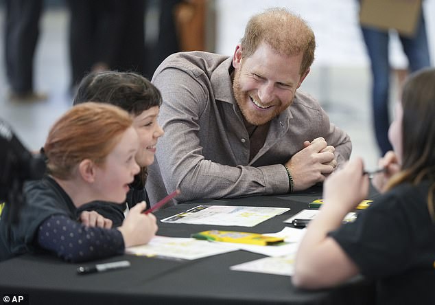 Prince Harry couldn't keep the smile from his face as he talked with students from Shaughnessy Elementary School