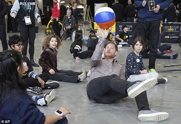 Harry showing off his skills during a game of sitting volleyball as the duke launched the Invictus Games School Programme on Monday