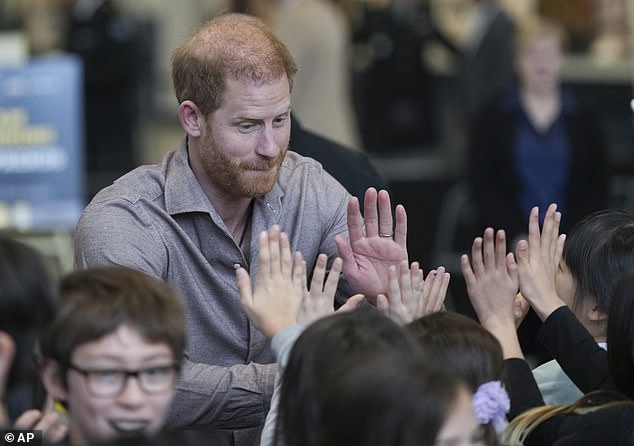 The Duke of Sussex seemed to be popular with the school children who were all eager to share a high five with the royal