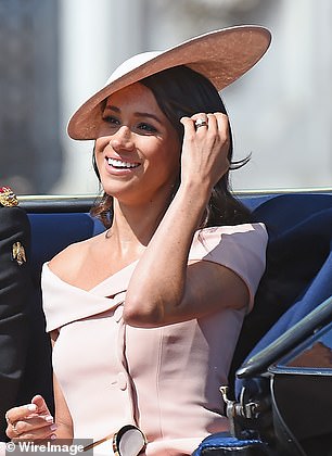 Meghan wore this straw slice hat by Philip Treacy at  Trooping the Colour in 2018