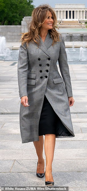 Two years later Melania wore a similar grey coat with matching double pockets and large lapels