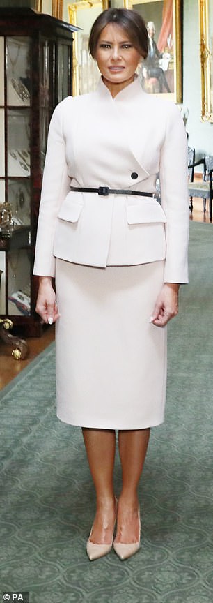 A month later Melania was also with the Queen when she was photographed in this Christian Dior outfit