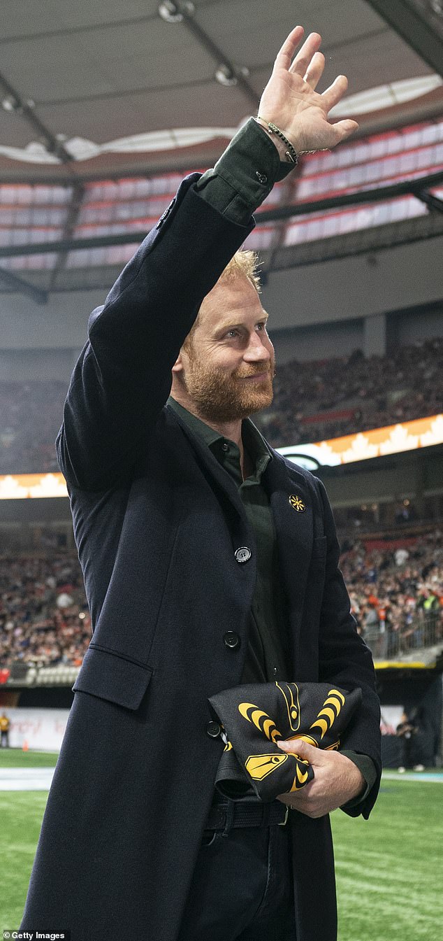 Prince Harry waves to the crowd during a jersey presentation prior to the start of the 2024 Grey Cup yesterday