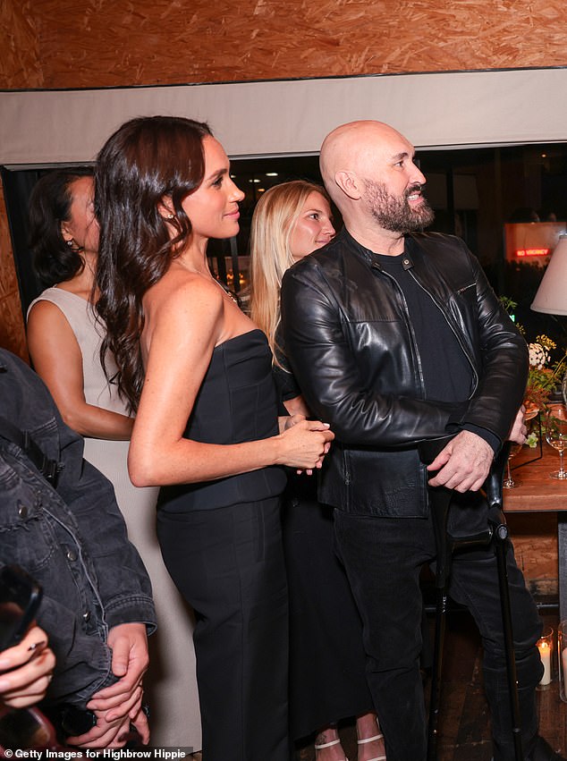 New photographs from the glamorous night out show Meghan dancing with her friends to a gospel choir performance in her strapless black ensemble