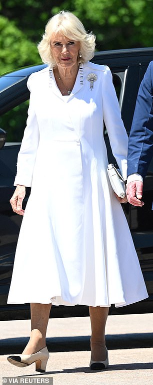 During her recent visit to Australia, Camilla recycled her white silk crepe dress and coat by Anna Valentine