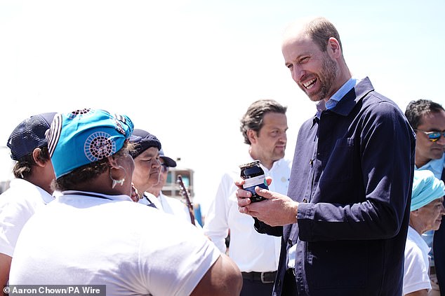 The Prince of Wales beamed as he accepted a jar of sour fig jam from fishermen and women at the Kalk Bay Harbour in Cape Town this morning