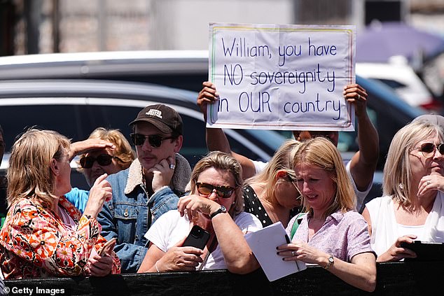 Although the Prince of Wales received a largely warm welcome, some protesters also gathered at the harbour