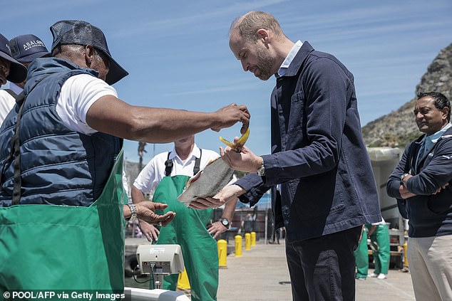 William was given the chance to hold the fresh fish in his hands