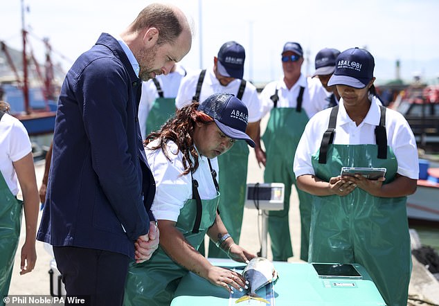 He watched on as the fish was measured to determine its size