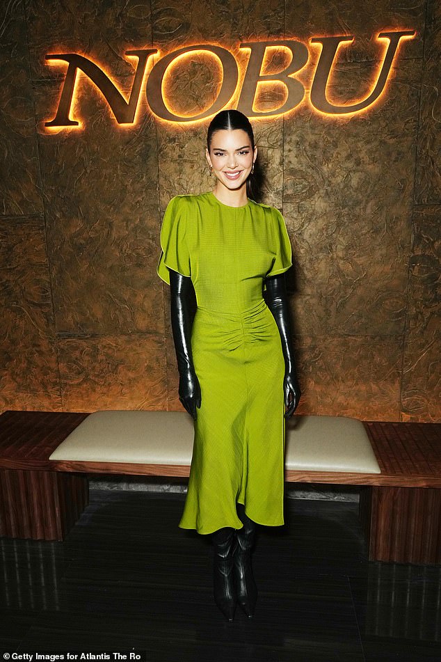 Kendall Jenner wearing the parrot green midi dress from Victoria Beckham's eponymous label