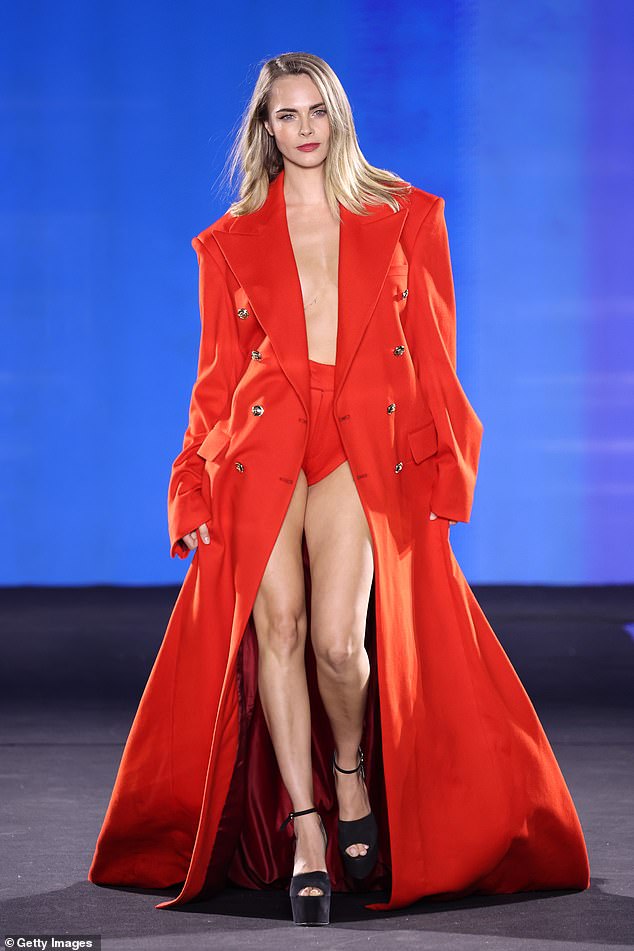 Red was embraced by Cara Delevingne at Paris Fashion Week, too