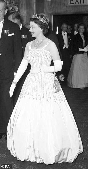 Queen Elizabeth II arriving at the Odeon, Leicester Square, in 1962, in the Peau De Soie taffeta dress by Norman Hartnell that was worn by Princess Beatrice at her wedding