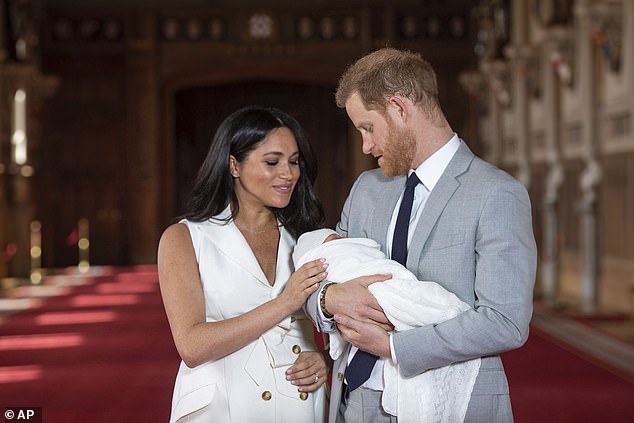 Harry brushed off his brother's warning to take it slow, claiming that he had to marry Meghan quickly because her 'biological clock was ticking' as she was almost 35 years old, according to a book. Pictured: The couple with their son Prince Archie in 2019