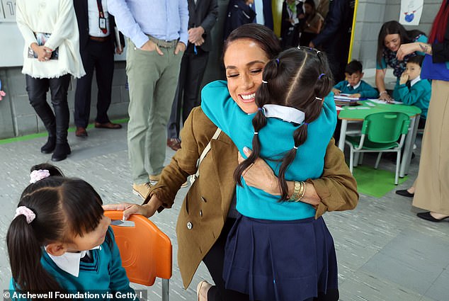 A photo of the Duchess of Sussex, Meghan, during a visit to a kindergarten school in Colombia