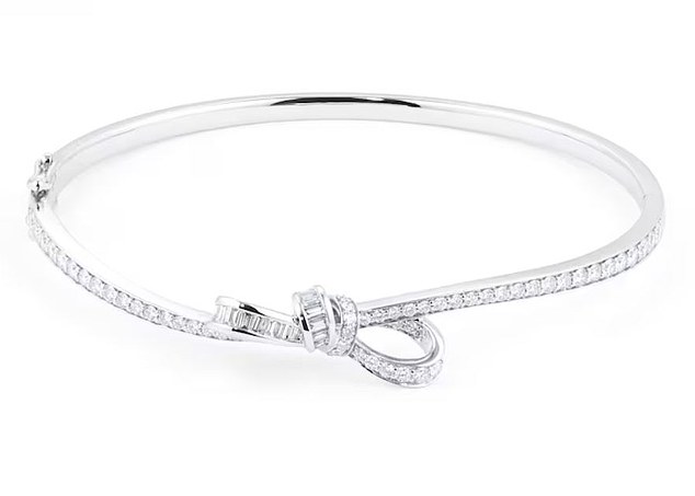 The £5,500 Renee bangle by Mappin & Webb showcases round brilliant and baguette diamonds that loop around one another to create a ribbon silhouette