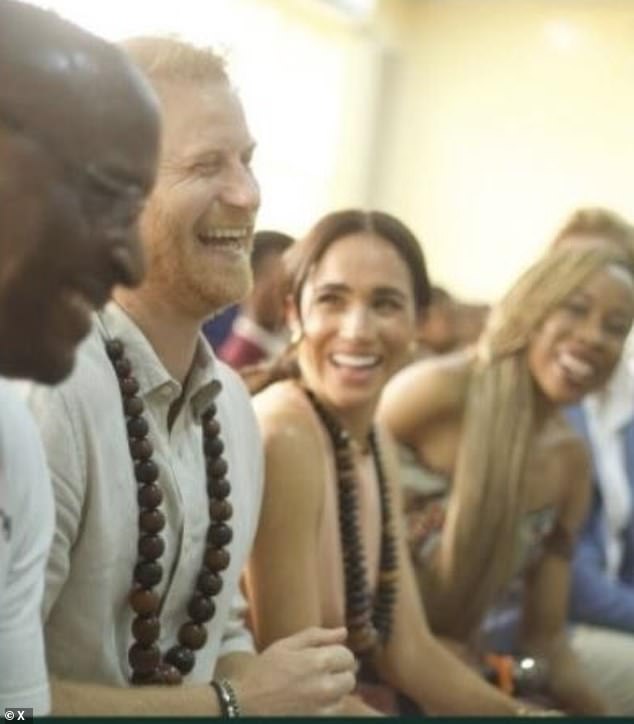 The royal couple also selected an photograph from their visit to Nigeria in May this year (pictured)