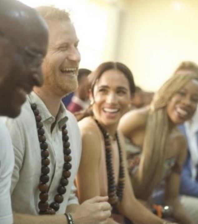 The Duke and Duchess of Sussex selected a photograph from their quasi-royal tour in Nigeria for their fourth image (pictured)