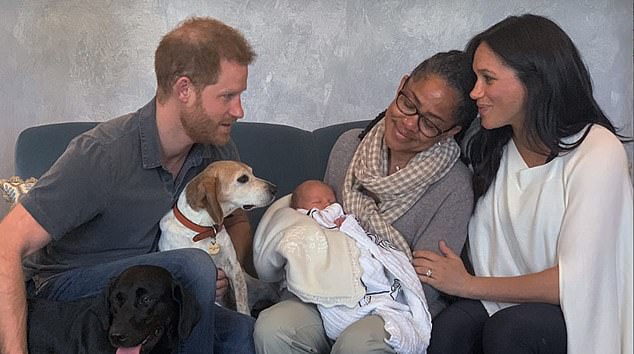 Baby Archie seen in the arms of his grandmother Doria Ragland as she sits alongside Meghan and Harry at Frogmore Cottage shortly after his birth