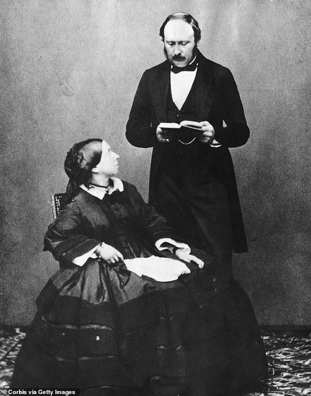 Prince Albert, wearing his hair in a combed-over fashion, photographed with his wife Queen Victoria