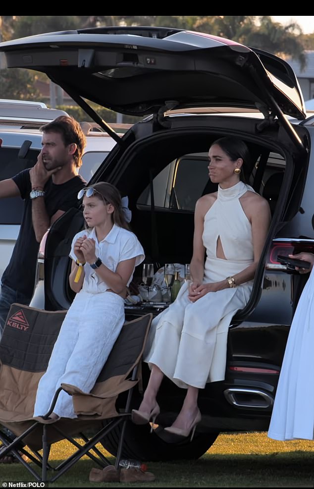 The Duchess of Sussex watching Prince Harry during a charity polo match during their Netlfix show Polo