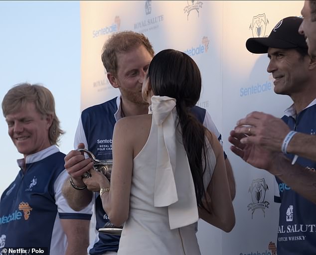 In one scene, Harry and Meghan share a sweet kiss, but the event in Florida was already photographed back in April