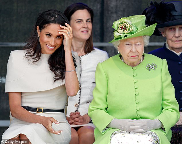 The Duchess of Sussex was invited by the Queen to help open the new Mersey Gateway Bridge. She arrived with the Queen who was wearing a hat, but Meghan was surprisingly hatless, with hair down doubled with a strong wind causing all sorts of problems with her hair.  She looked stunning in a cream Givenchy dress