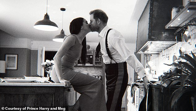 Meghan and Harry seen kissing in the kitchen at Frogmore Cottage in Windsor. The photo was revealed in the couple's Netflix documentary