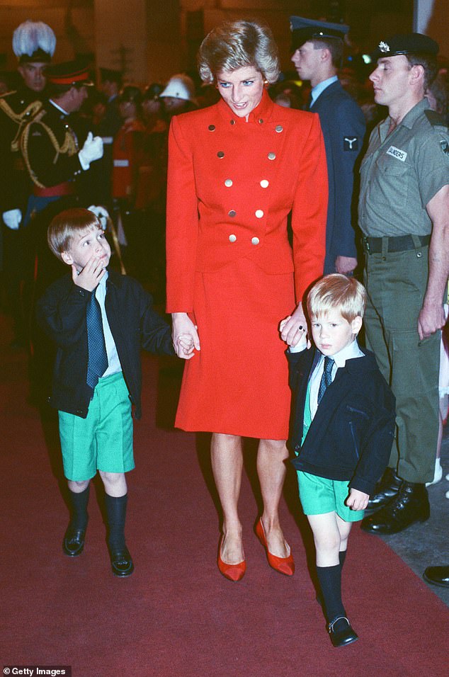 The two brothers wearing matching outfits with their mother in 1988